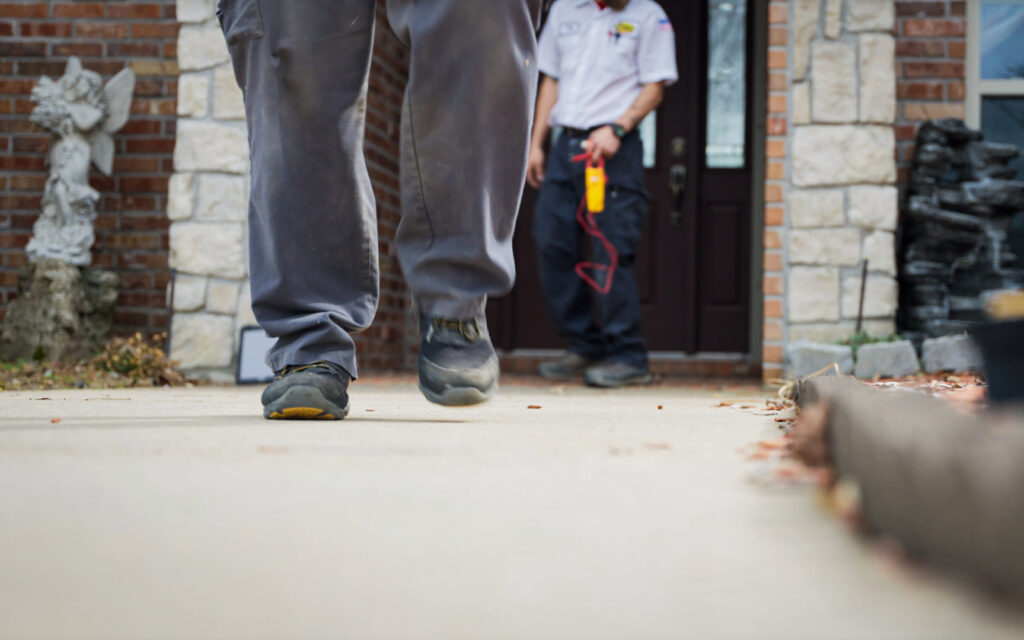 A Mister Sparky NWA electrician arriving at a residential home, ready to provide electrical service in Springdale, AR.