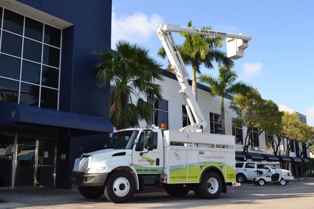 An electrician bucket truck ready for service by Tri-Systems Group, Inc Electrical Service Contractors in Miami, FL.