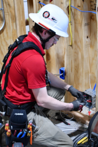 An electrician connecting wires in an electrical box at MetroPower, Inc. in Albany, GA.