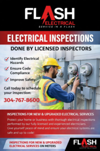 An electrician in a hard hat and safety vest inspecting outdoor electrical meters for Flash Construction in Winifrede, WV.