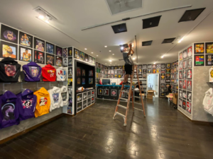 An electrician installing new commercial lighting fixtures in a retail store by C&S Electrical Services LLC in Ashburn, VA.