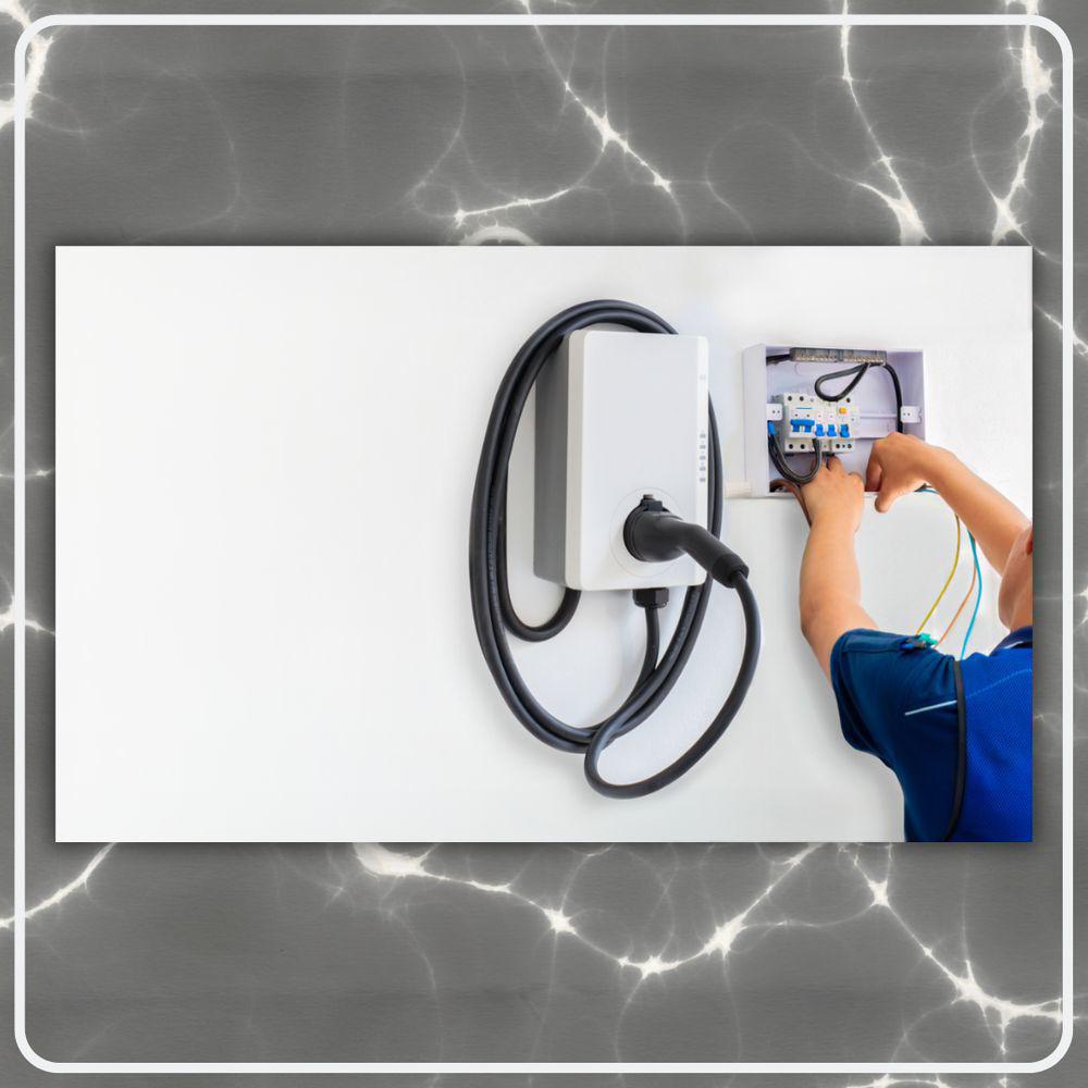 An electrician installing an EV charger and working on an electrical panel for Clarity Handyman Service in Raleigh, NC