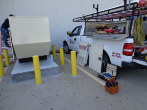 An electrician from Corley Electric & Automatic Power Solutions installing a Baldor generator in Fort Smith, AR.