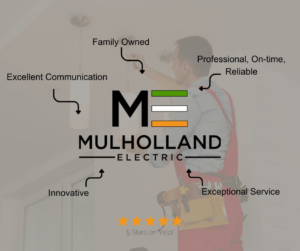 An electrician installing a new light fixture for a client of Mulholland Electric Inc in San Francisco, CA.