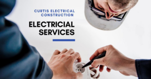 An electrician installing or repairing an electrical outlet for Curtis Electrical Construction, Inc. in Bakersfield, CA.