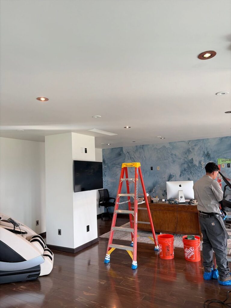 An Electricode electrician on a job site with a ladder, ready to perform electrical work in Las Vegas, NV.