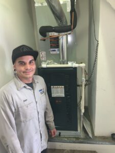 An electrician performing AC electrical diagnostics with a multimeter for Cool Aid Air Conditioning in Scottsdale, AZ