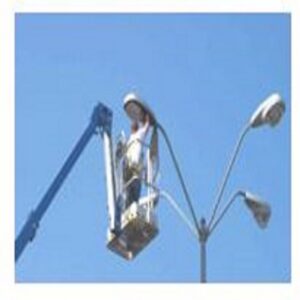 An electrician in a boom lift repairing a street light for Gerard A LaFlamme Inc in Londonderry, NH.