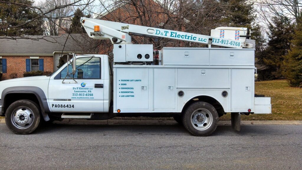 A D&T Electric LLC service truck with a boom lift, ready for commercial and residential electrical work in Lancaster, PA.