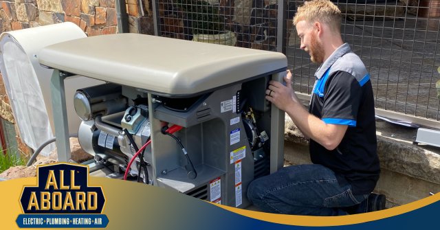 An electrician from All Aboard Services servicing a Generac home generator in Farr West, UT.