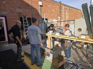 A team of electricians from Hummingbird Electric Inc. working on an outdoor electrical service installation in Tulsa, OK.
