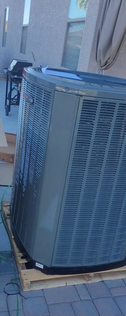 An electrician testing AC unit electrical components with a multimeter for Cool Aid Air Conditioning in Scottsdale, AZ