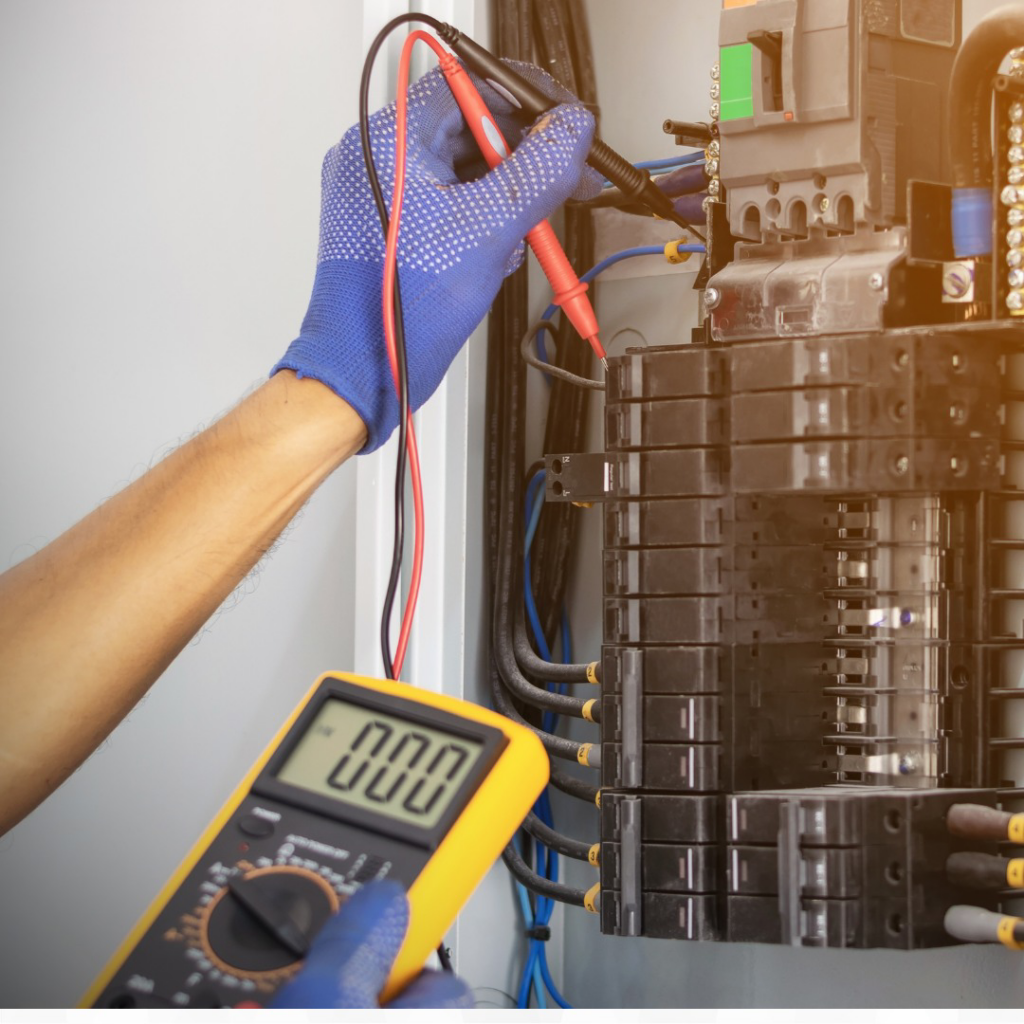 An electrician testing an electrical panel with a multimeter at DFW Master Electricians - FC in Arlington, TX