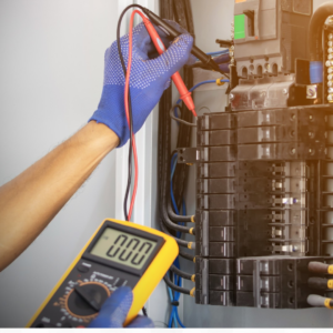 An electrician testing an electrical panel with a multimeter at DFW Master Electricians - FC in Arlington, TX