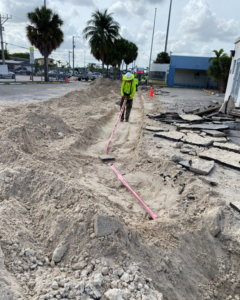 An electrician trenching for underground wiring installation by Canseco Electrical Contractors, Inc. in Miami, FL.