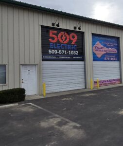 A 509 Electric service truck parked at a commercial construction site, ready for electrical installation in Yakima, WA.