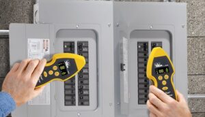 An electrician using a circuit breaker finder on an electrical panel for OMR Electrical Contractors Inc. in Cape Coral, FL.