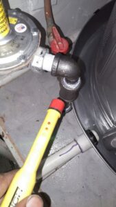 An electrician from IRV Plumbing, Electric & HVAC using a non-contact voltage tester to check for electricity in Charlotte, NC