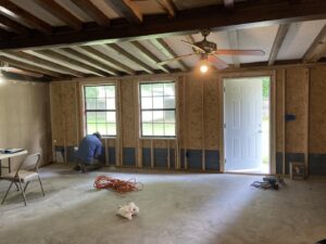 An electrician performing electrical wiring during new construction for Mr. Electric of Montgomery County Alabama in Montgomery, AL.
