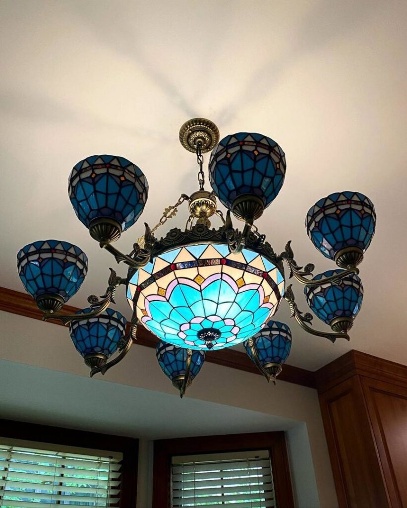 An electrician from High Electrical working on wiring near a water heater in Atlanta, GA.