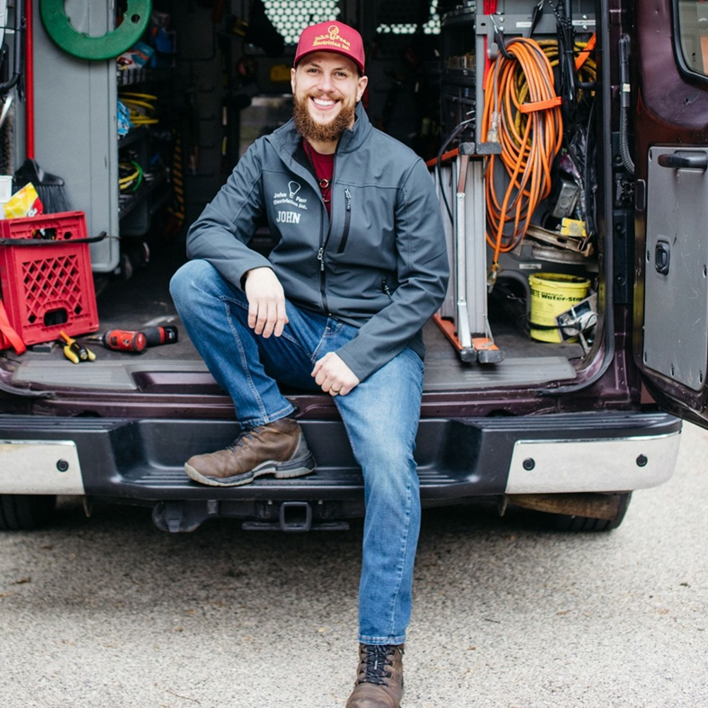 An electrician from John Fean Electrician Inc. with his work van and tools in Philadelphia, PA.