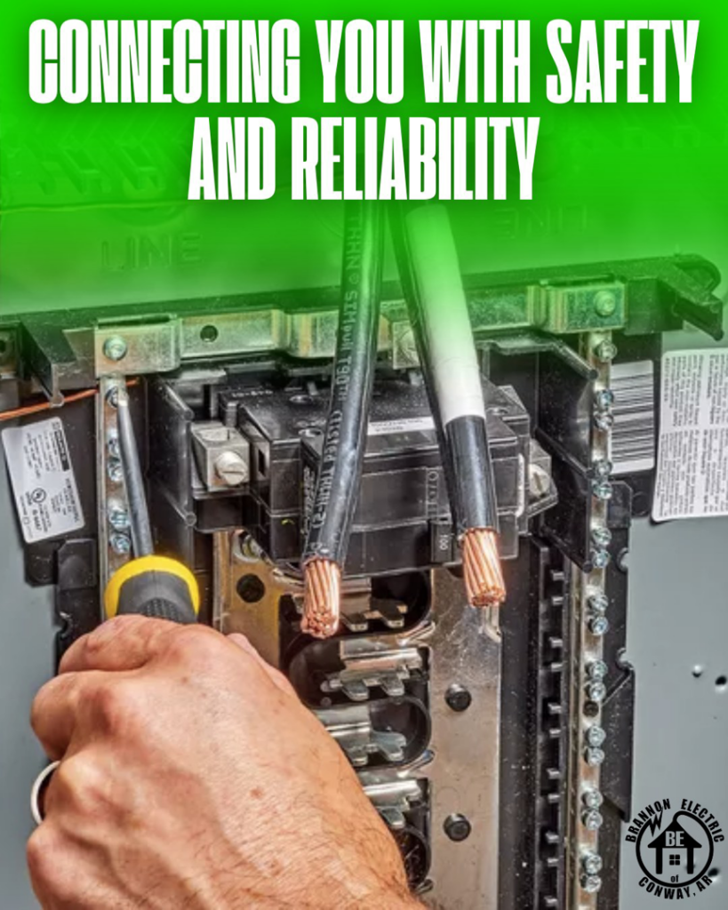 An electrician connecting wires in an electrical panel for Brannon Electric, LLC in Canton, GA.