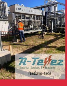 An electrician in a safety vest working on a large industrial electrical panel outdoors for A-Tellez Electrical Services & Solutions L.L.C in Houston, TX.