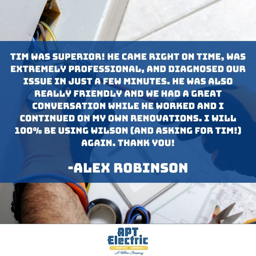 An electrician from APT Electric working on electrical components with tools in Chesterland, OH.