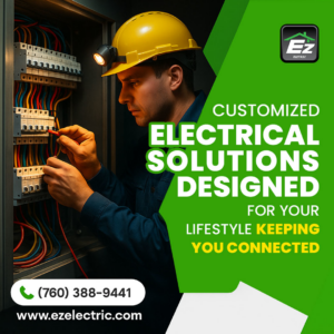 An electrician wearing a hard hat working on an electrical panel for EZ Electric in San Diego, CA