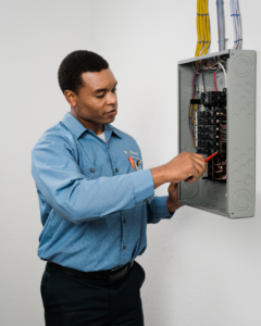 An electrician working on an electrical panel for a client of Mr. Electric of Tulsa - Metro in Tulsa, OK.