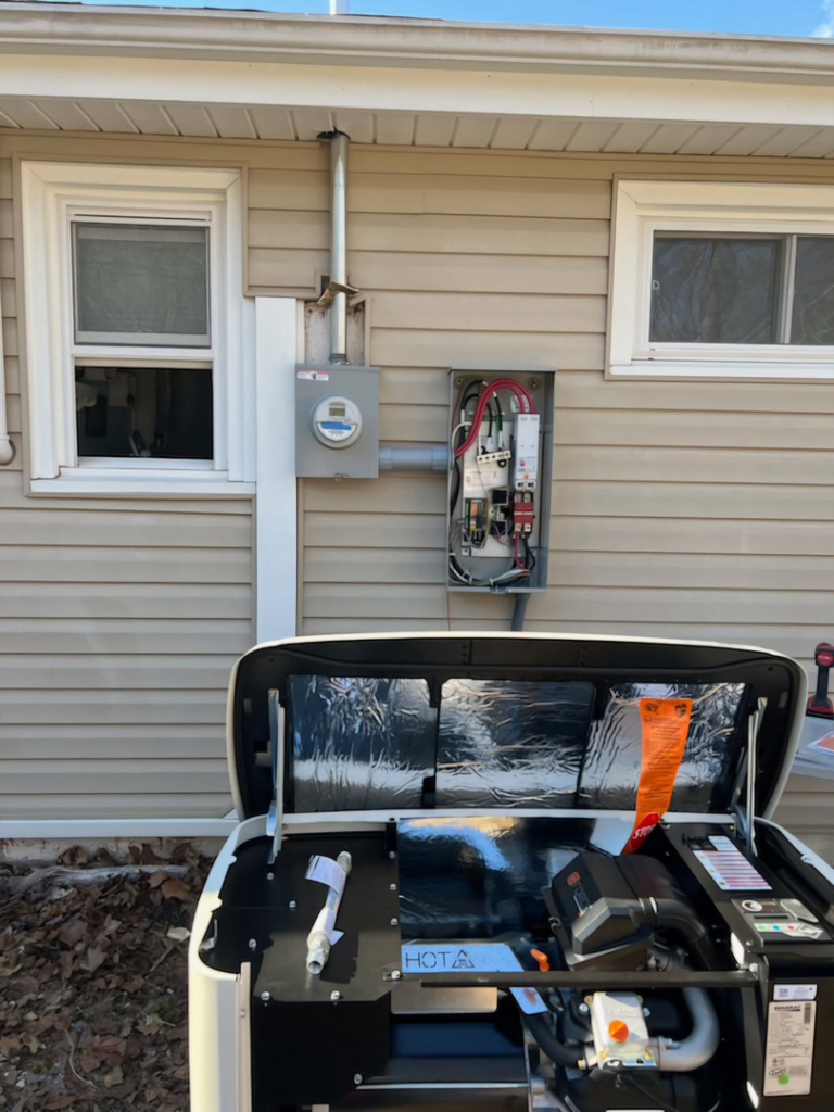 An open Generac generator and electrical service panel showing wiring and components, indicating work by RJ Boyd Electric in Christiansburg, VA.