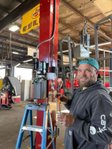 An electrician working on industrial wiring and electrical components at a job site for D. Geer Electric Inc. in Waukegan, IL.