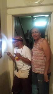 An electrician from WG Electrical Services, LLC working on an electrical outlet in a home in Laurel, MD.