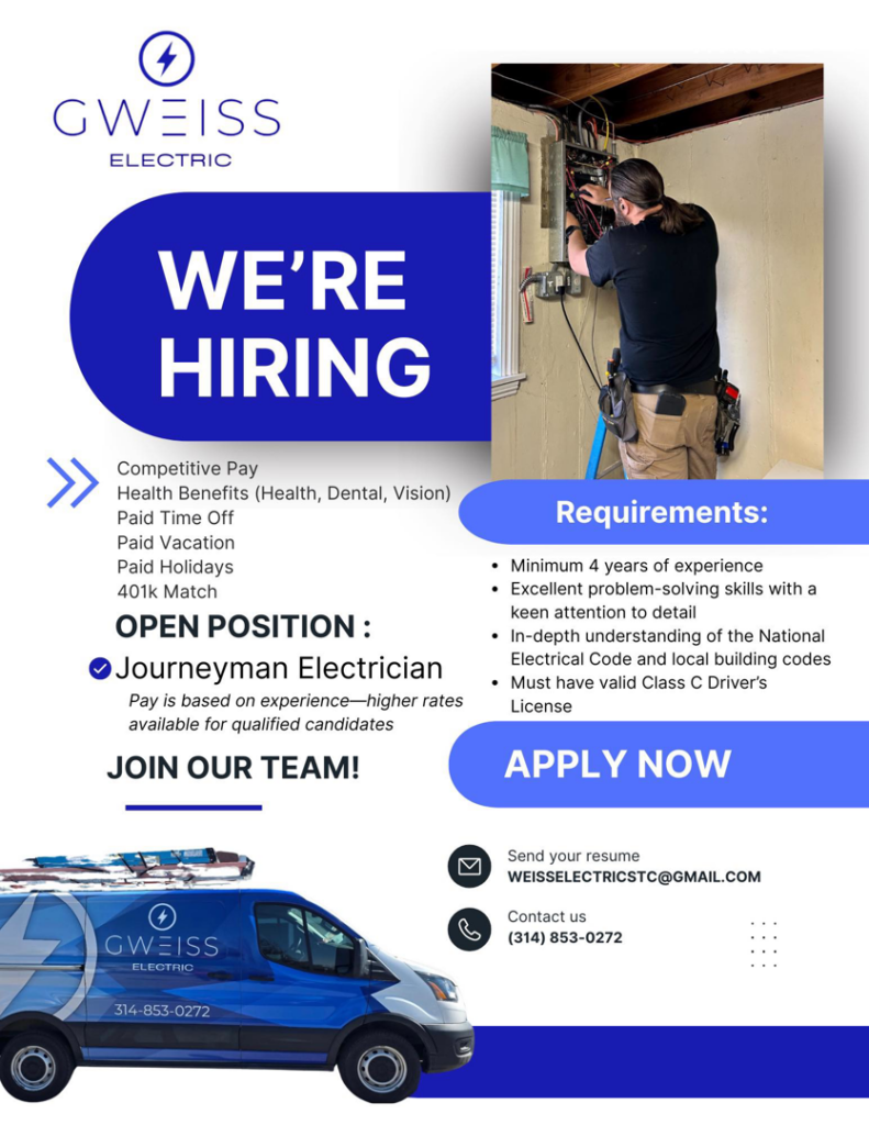 An electrician performing work on an electrical panel for Weiss Electric in Anoka, MN