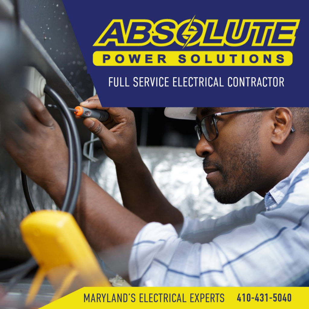 An electrician working on electrical wiring with a screwdriver for Absolute Power Solutions USA in Annapolis, MD.