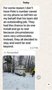 Electricians from Grand Electric installing a generator in a snowy outdoor location in Melbourne, FL.