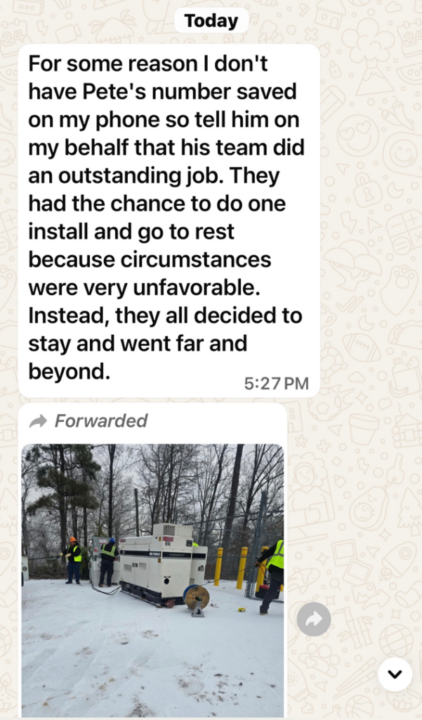 Electricians from Grand Electric installing a generator in a snowy outdoor location in Melbourne, FL.