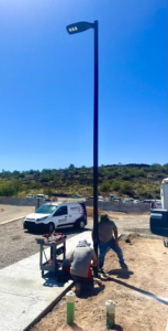 Electricians from Myres Electrical Service installing a new street light in Mesa, AZ