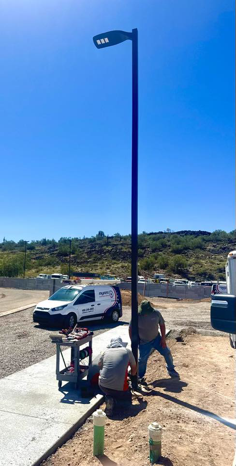 Electricians from Myres Electrical Service installing a new street light in Mesa, AZ