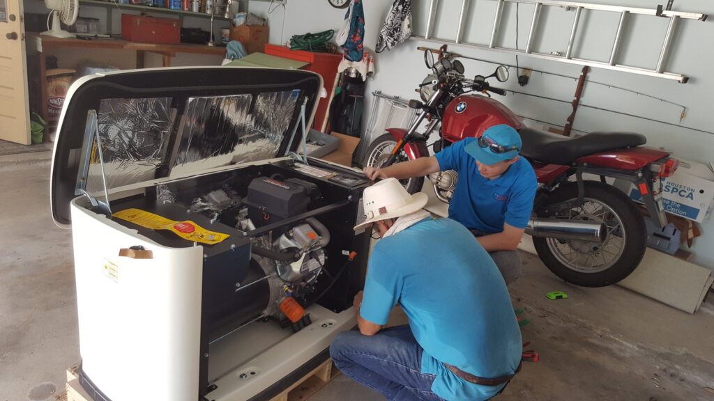 Two electricians servicing an open Generac generator in a garage for Peace Of Mind Services in Sag Harbor, NY