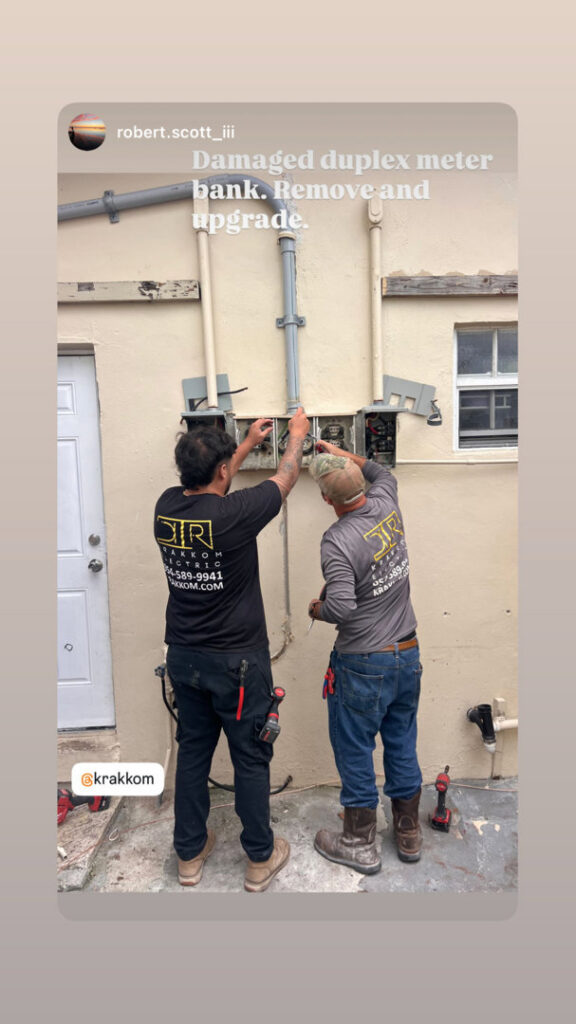 Two electricians from Krakkom Electric in Sunrise, FL, upgrading a damaged duplex meter bank.