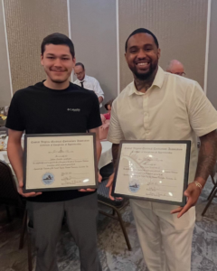 Two electricians proudly display their apprenticeship completion certificates for S.J. Ryan Electric, Inc. in Midlothian, VA.