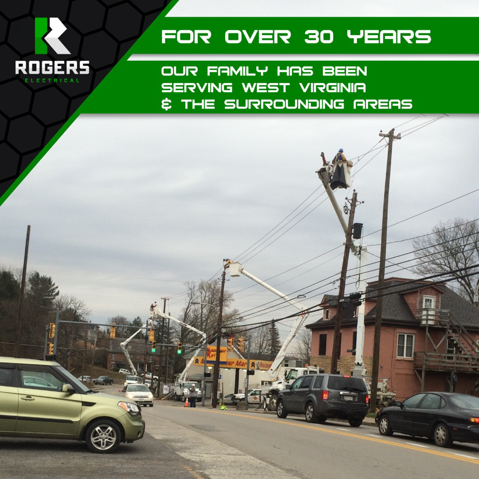 Electricians in bucket trucks working on power lines and utility poles for Rogers Electrical Contracting Company Inc in Fairmont, WV.