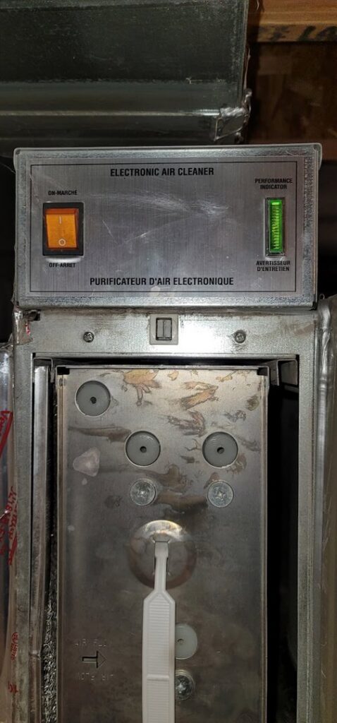 An electronic air cleaner unit installed with ductwork, demonstrating air quality services by Northern Peak Heating & Cooling in Bozeman, MT.