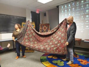 An elegant living room featuring a large, ornate area rug, a quality installation by Ko-Z-Craft in Los Angeles, CA.