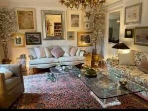 An elegant living room featuring a beautiful area rug, showcasing design possibilities from Woven Treasures, Inc in Mobile, AL.