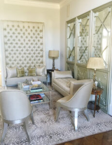 An elegant living room featuring a light-colored, patterned area rug, a completed project by Dallas Rugs in Dallas, TX.