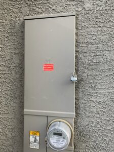 An exterior emergency disconnect electrical panel with a padlock, installed by Canyon Electric Company, Inc. in North Las Vegas, NV