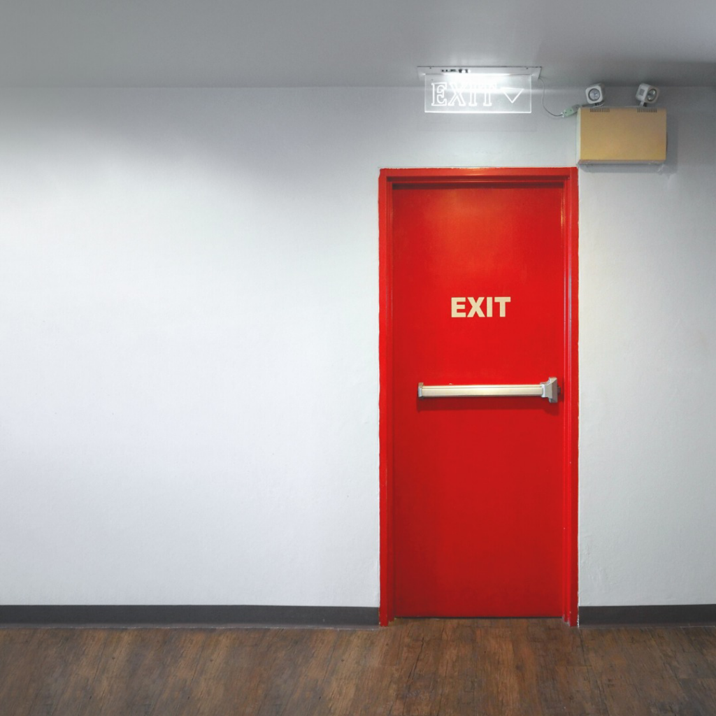 An illuminated emergency exit sign and lights, installed by Access Hardware Inc in Honolulu, HI