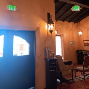 Emergency exit signs and wall sconces installed by Ride the Lightning Electrical Services in El Cajon, CA.